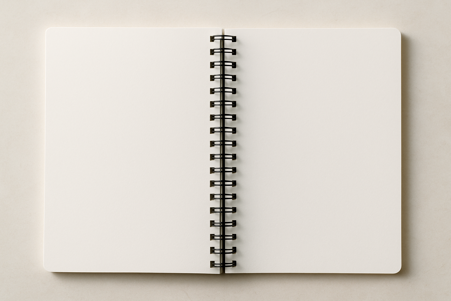 spiral bound notebook opened with unruled pages